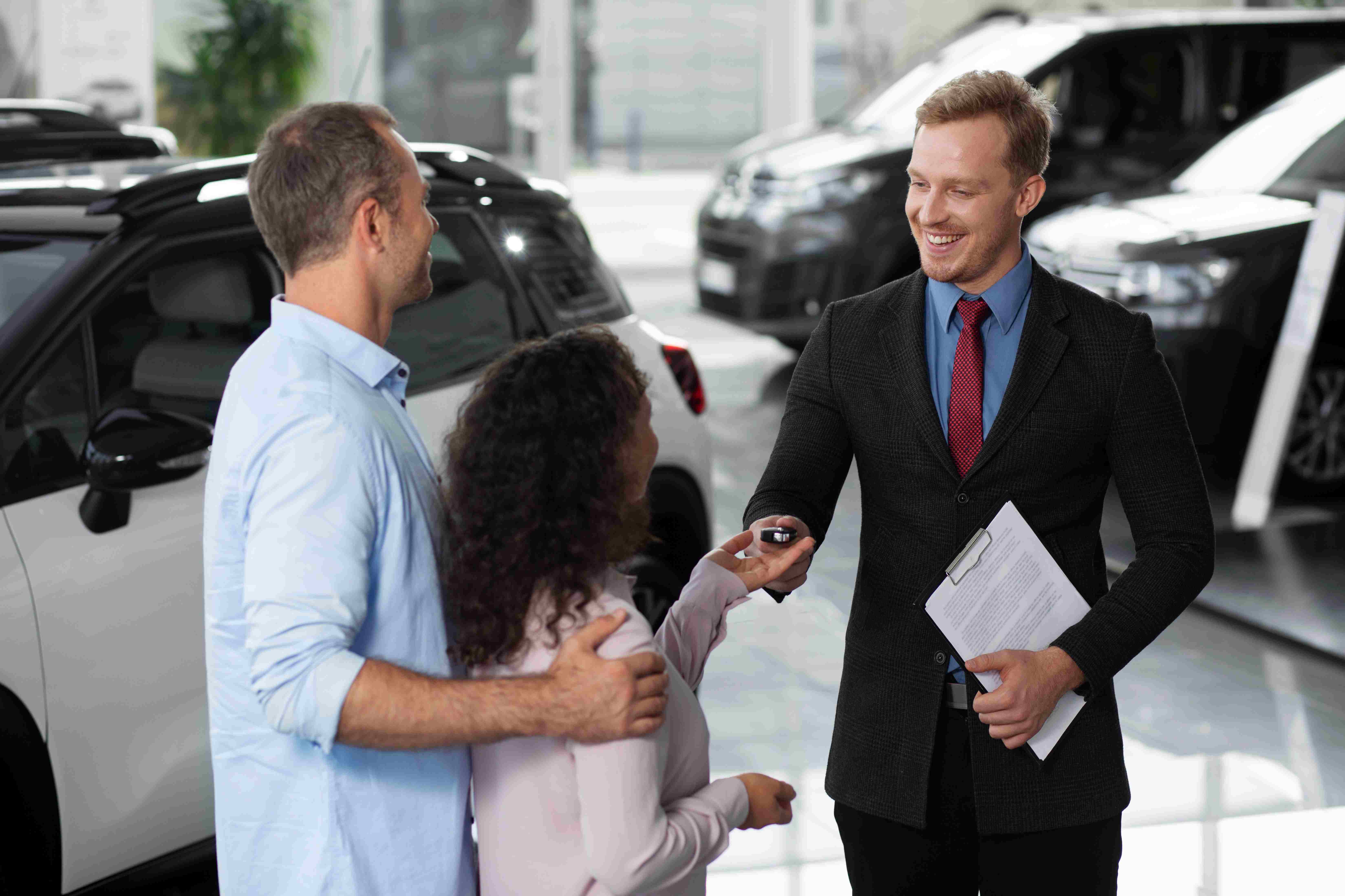 Happy family with new car and keys